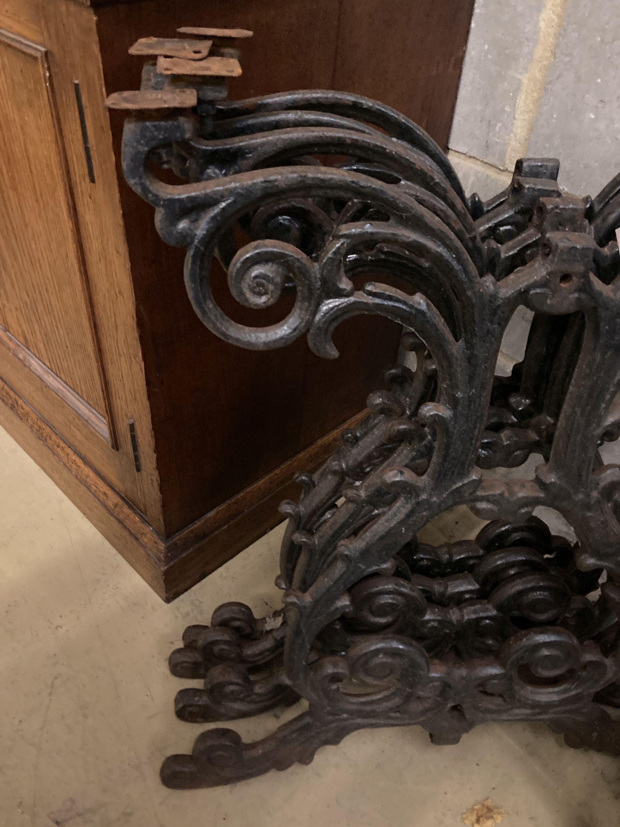 A set of four Victorian style cast iron table supports, each width 54cm, height 66cm